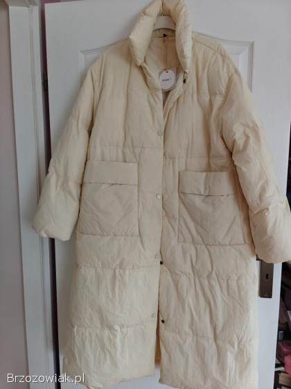 Długa beżowo biała pikowana kurtka