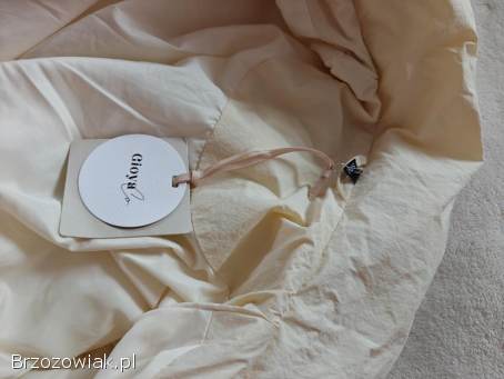 Długa beżowo biała pikowana kurtka